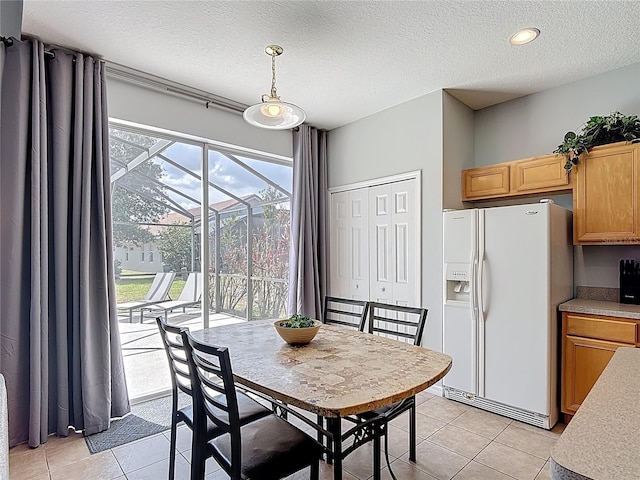 131 Stella Pass, Davenport, FL 33837 - dining area featuring light tile patterned floors and a textured ceiling