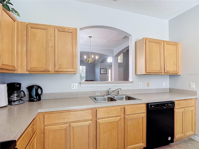 131 Stella Pass, Davenport, FL 33837 - kitchen featuring dishwasher, arched walkways, a sink, a textured ceiling, and light brown cabinets
