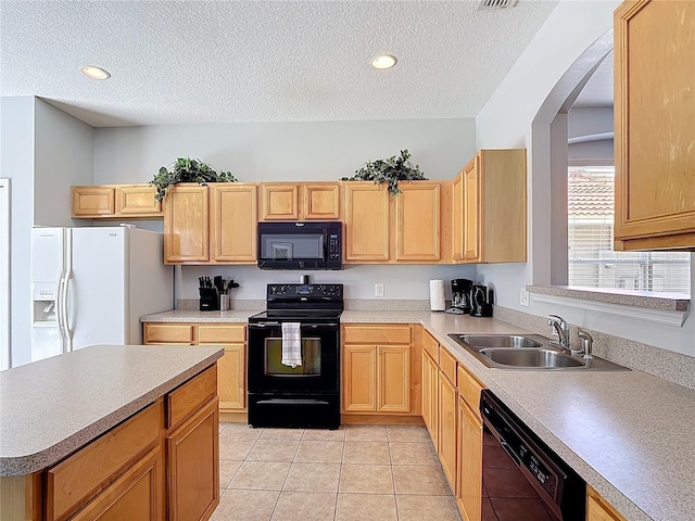 131 Stella Pass, Davenport, FL 33837 - kitchen with black appliances, a sink, a textured ceiling, arched walkways, and light tile patterned floors
