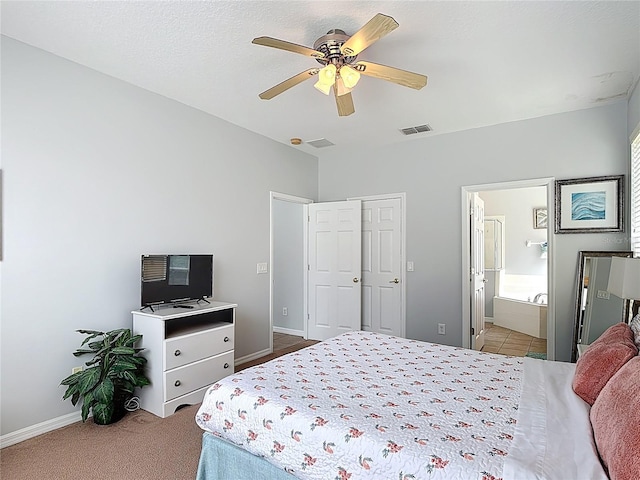131 Stella Pass, Davenport, FL 33837 - carpeted bedroom featuring baseboards, ceiling fan, a closet, and connected bathroom