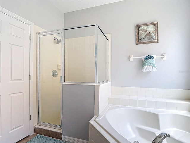 131 Stella Pass, Davenport, FL 33837 - bathroom featuring a stall shower and a garden tub