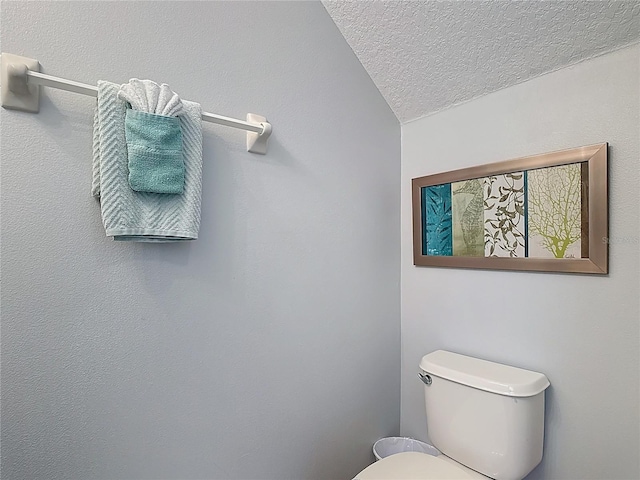 131 Stella Pass, Davenport, FL 33837 - bathroom with a textured ceiling and toilet