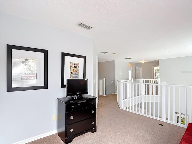 131 Stella Pass, Davenport, FL 33837 - hall featuring carpet, an upstairs landing, and baseboards