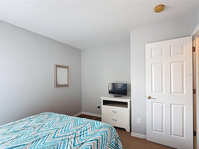 131 Stella Pass, Davenport, FL 33837 - bedroom featuring dark carpet and baseboards