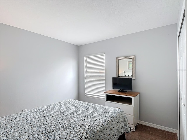 131 Stella Pass, Davenport, FL 33837 - bedroom with dark carpet and baseboards