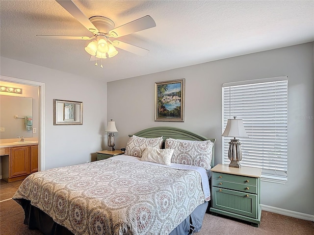 131 Stella Pass, Davenport, FL 33837 - bedroom with carpet, a sink, a ceiling fan, connected bathroom, and baseboards