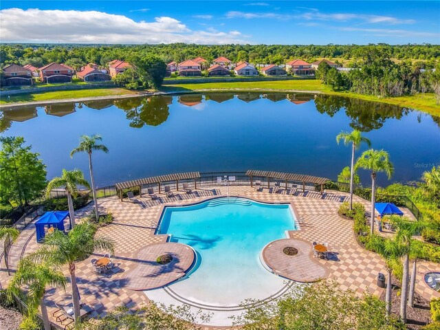 131 Stella Pass, Davenport, FL 33837 - community pool with a pergola, a water view, and a patio area
