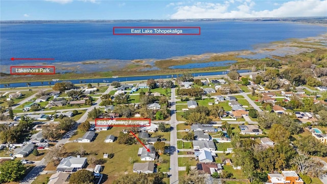 birds eye view of property with a water view and a residential view