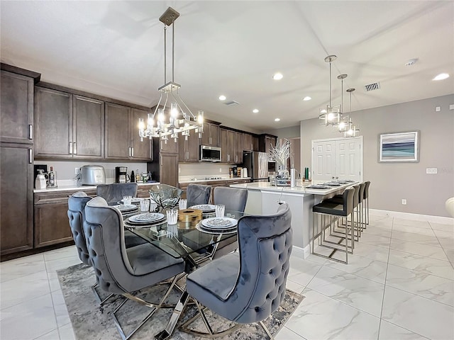 dining space with recessed lighting, marble finish floor, visible vents, and baseboards