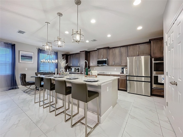 kitchen with marble finish floor, visible vents, appliances with stainless steel finishes, and dark brown cabinets