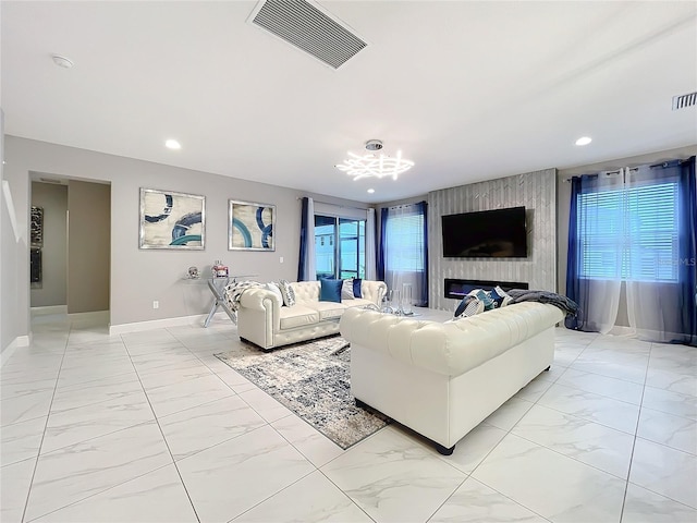 living area with recessed lighting, marble finish floor, visible vents, and baseboards