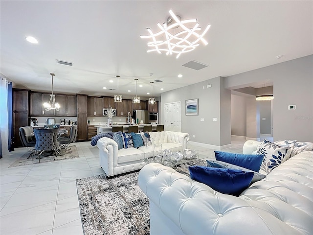 living room featuring baseboards, visible vents, marble finish floor, a chandelier, and recessed lighting