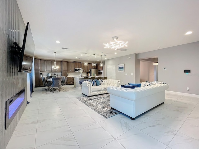 living room featuring recessed lighting, marble finish floor, visible vents, and baseboards