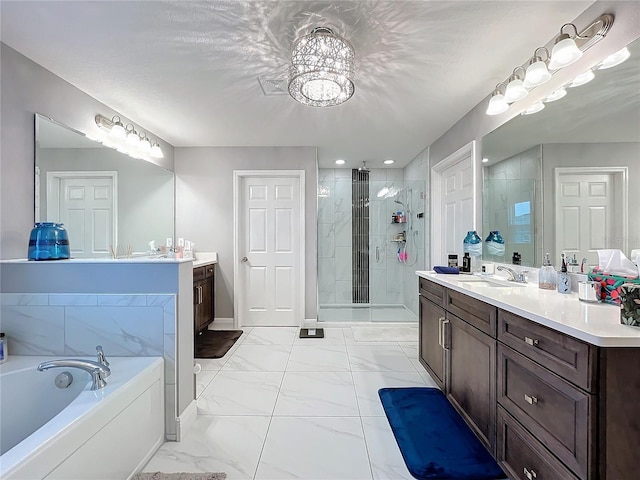 bathroom with marble finish floor, a stall shower, two vanities, and a bath