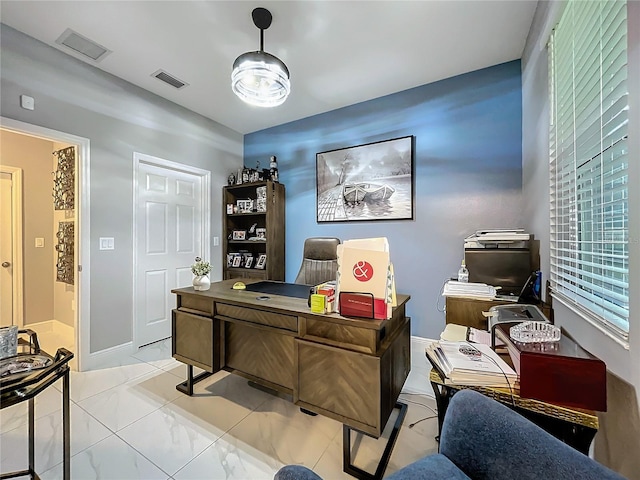 office area with baseboards and visible vents