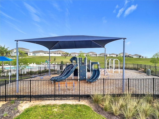 community jungle gym featuring fence