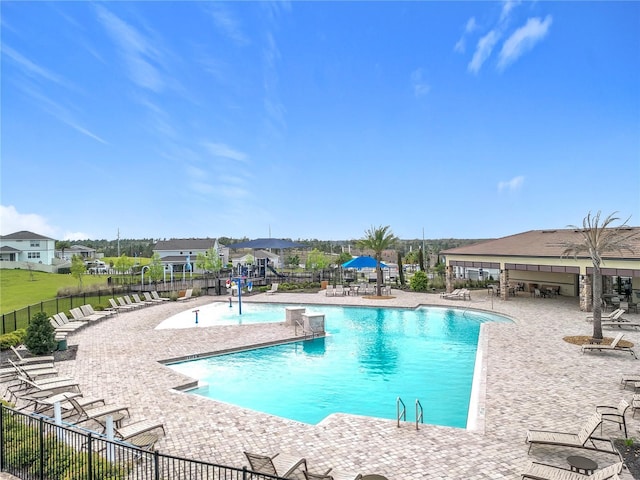 pool featuring a patio area and fence