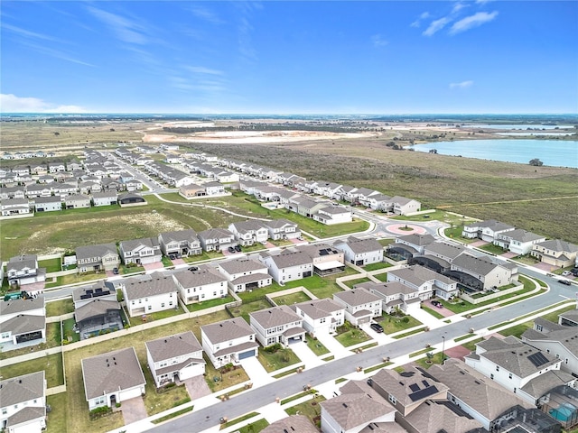 bird's eye view featuring a residential view and a water view