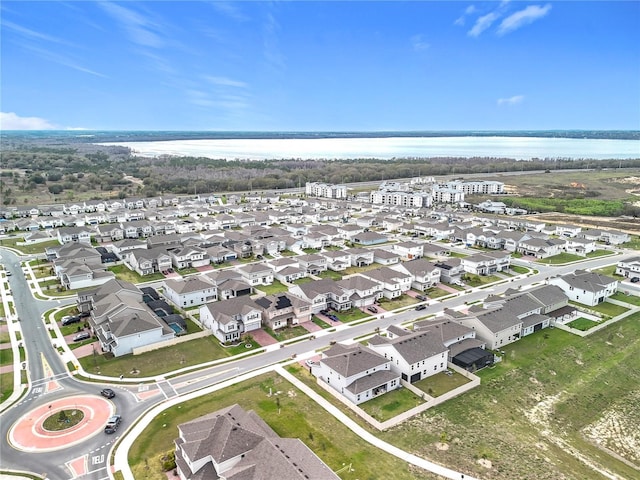 aerial view with a water view and a residential view