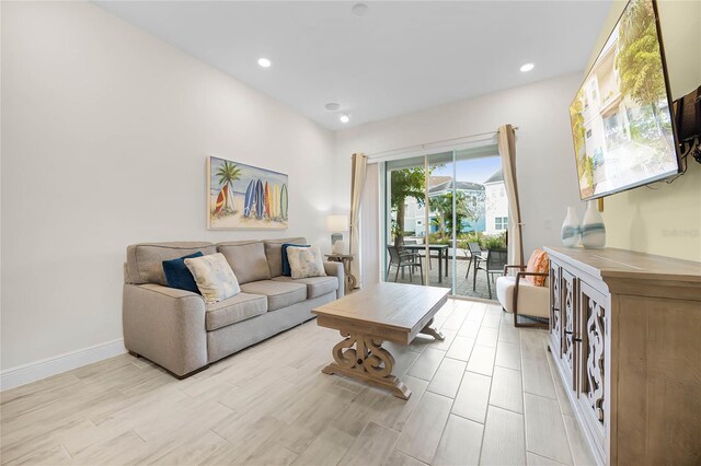 8012 Lost Shaker Ln, Kissimmee, FL 34747 - living area with light wood-style flooring, recessed lighting, and baseboards