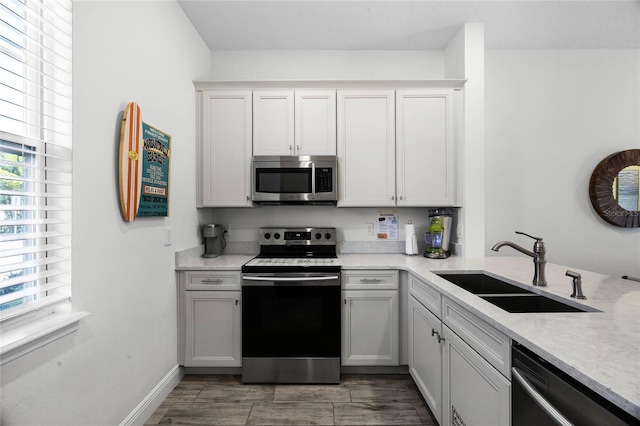 8012 Lost Shaker Ln, Kissimmee, FL 34747 - kitchen with a sink, stainless steel appliances, and baseboards