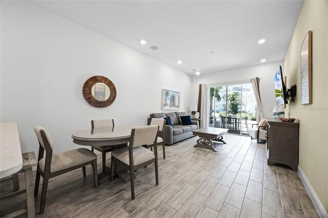 8012 Lost Shaker Ln, Kissimmee, FL 34747 - dining room with recessed lighting, baseboards, and light wood-style flooring