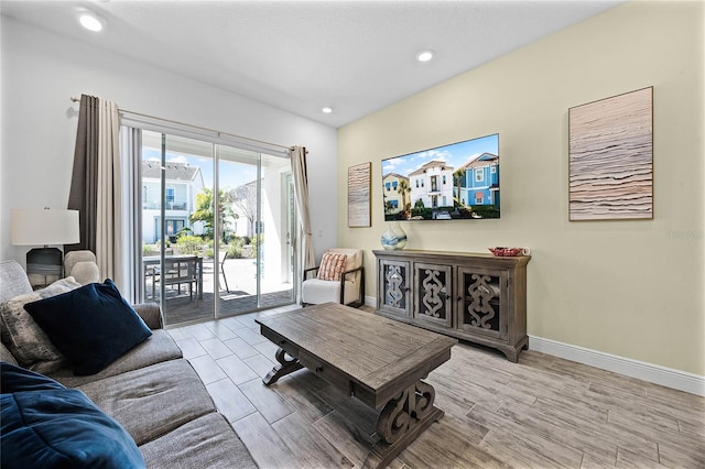 8012 Lost Shaker Ln, Kissimmee, FL 34747 - living room with recessed lighting, wood finished floors, and baseboards