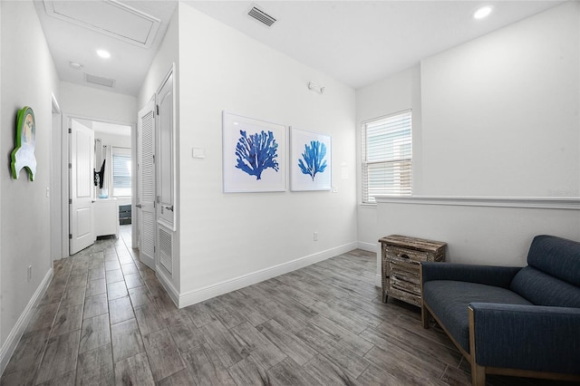 8012 Lost Shaker Ln, Kissimmee, FL 34747 - living area featuring a wealth of natural light, visible vents, attic access, and wood finished floors