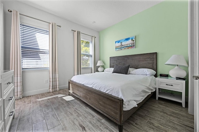 8012 Lost Shaker Ln, Kissimmee, FL 34747 - bedroom with baseboards and wood finished floors