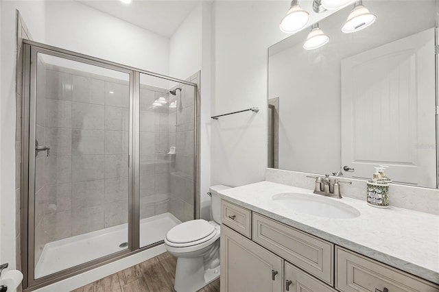 8012 Lost Shaker Ln, Kissimmee, FL 34747 - full bathroom featuring wood finished floors, toilet, a stall shower, and vanity