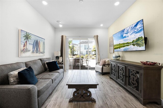 8012 Lost Shaker Ln, Kissimmee, FL 34747 - living room featuring recessed lighting and wood tiled floor