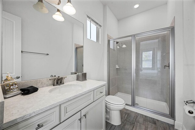 8012 Lost Shaker Ln, Kissimmee, FL 34747 - full bathroom featuring a wealth of natural light, a shower stall, and toilet