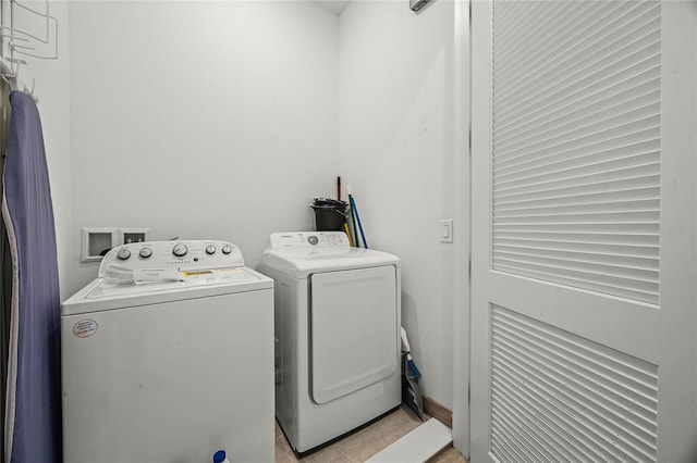 8012 Lost Shaker Ln, Kissimmee, FL 34747 - clothes washing area with independent washer and dryer and laundry area