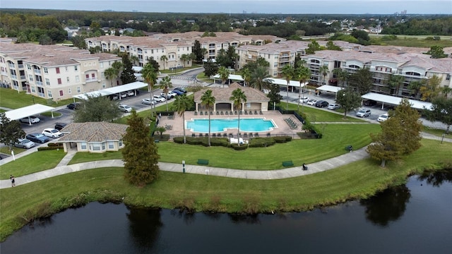 drone / aerial view with a residential view and a water view