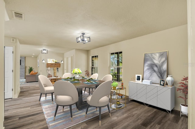 628 Eastwood Ct, Altamonte Springs, FL 32714 - dining area featuring visible vents, a textured ceiling, and wood finished floors
