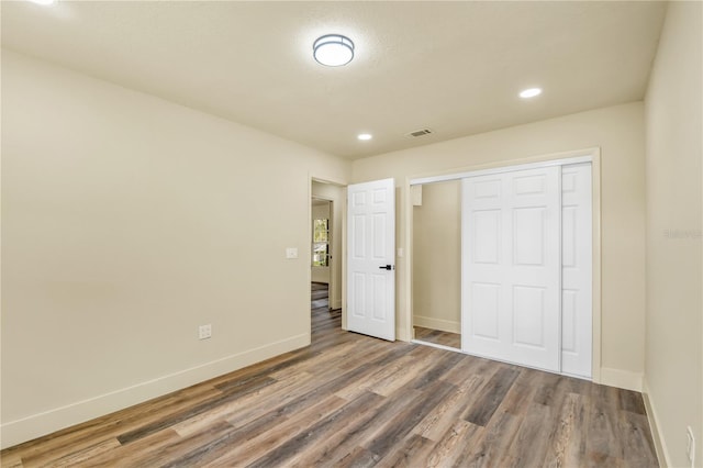 628 Eastwood Ct, Altamonte Springs, FL 32714 - unfurnished bedroom featuring dark wood-style floors, a closet, visible vents, and baseboards