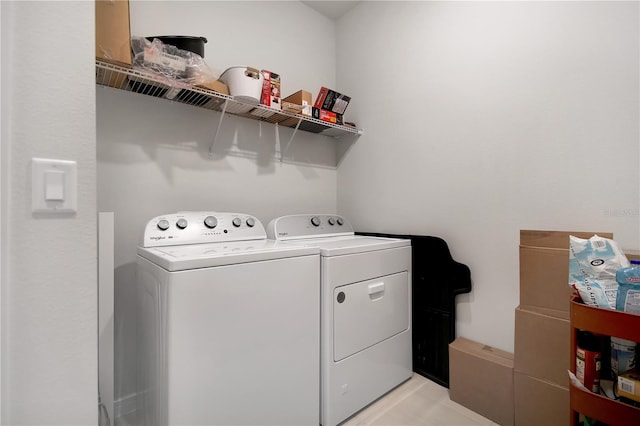 laundry room featuring laundry area and washer and clothes dryer