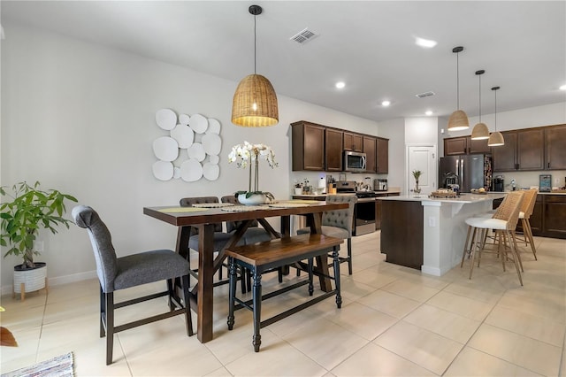 dining area featuring recessed lighting, visible vents, baseboards, and light tile patterned flooring