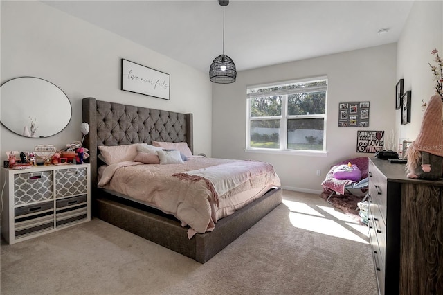 bedroom with carpet floors and baseboards