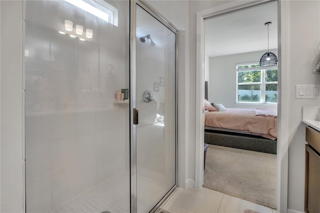 full bathroom with tile patterned flooring, connected bathroom, vanity, and a shower stall