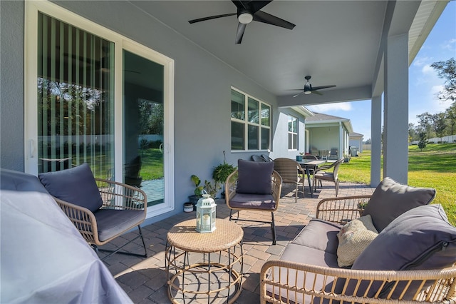 view of patio / terrace with ceiling fan, outdoor dining area, and outdoor lounge area