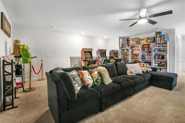 living room with recessed lighting, baseboards, a ceiling fan, and light colored carpet