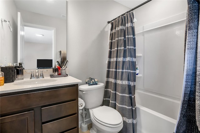 full bath with shower / bathtub combination with curtain, toilet, and vanity