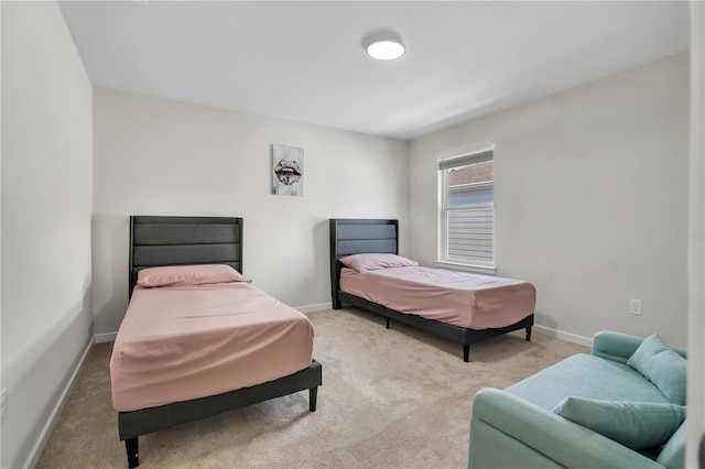 bedroom with carpet flooring and baseboards