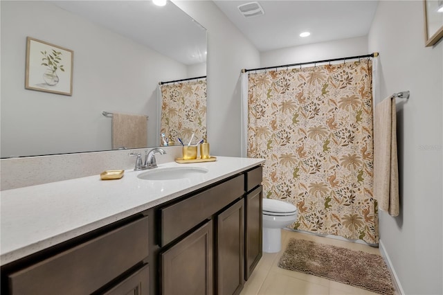 bathroom featuring toilet, tile patterned floors, visible vents, and vanity