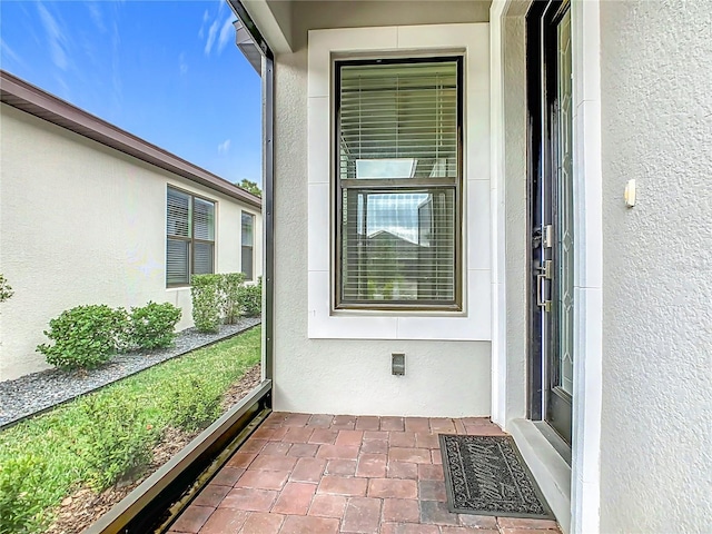 unfurnished sunroom with visible vents