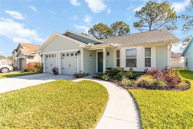 ranch-style house with an attached garage, driveway, and a front yard