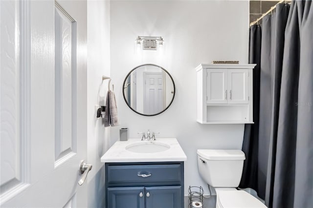 full bathroom featuring toilet and vanity