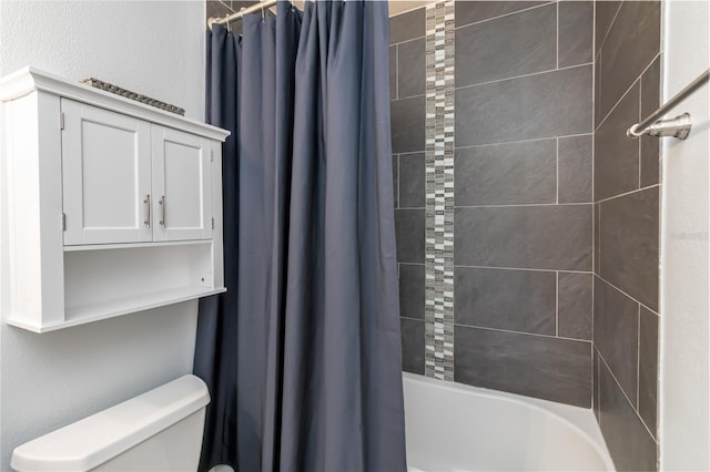 full bath with toilet and shower / bath combo with shower curtain