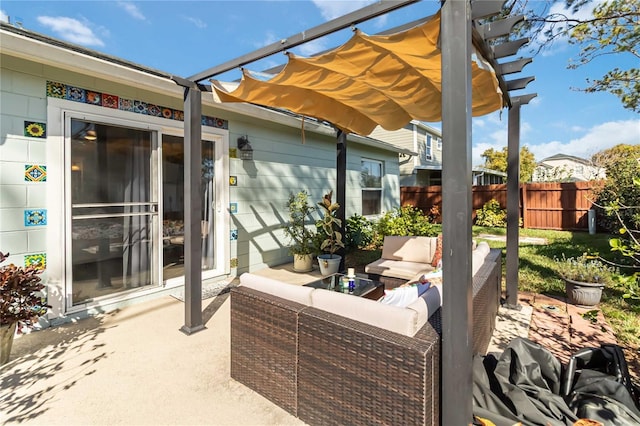 view of patio with outdoor lounge area, fence, and a pergola